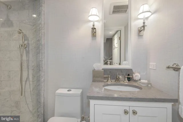 a view of a chair and tables in the backyard