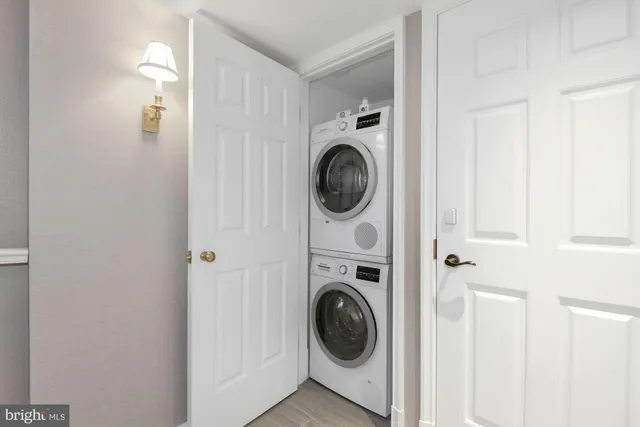 a brick building with a bench in front