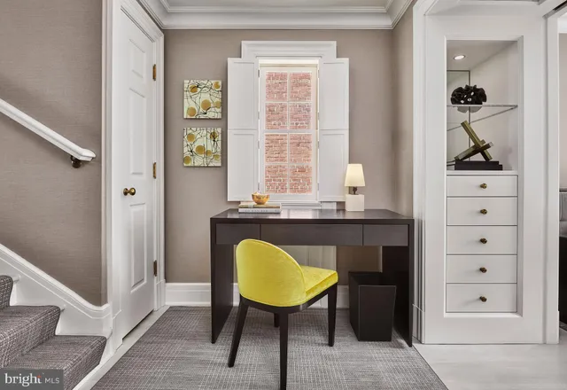 a view of living room with chair and window