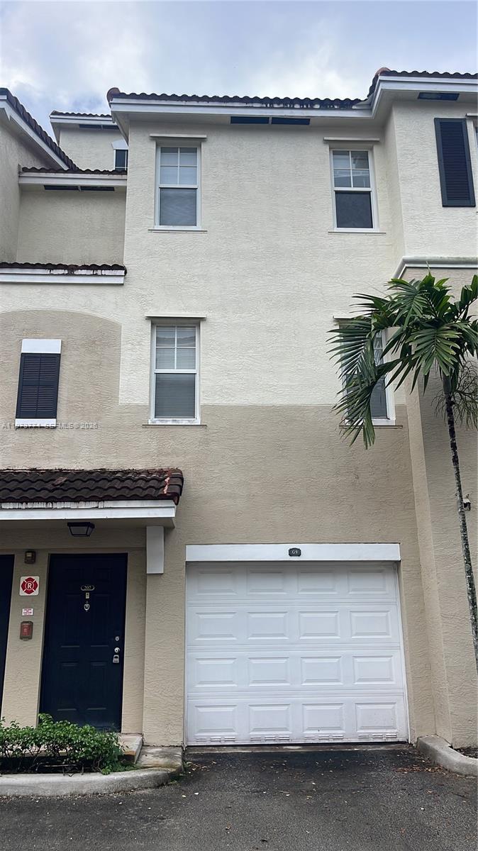 6020 West Sample Road, Unit 207 Coral Springs, FL 33067 - Photo 16 of 17 a kitchen with a sink and a stove