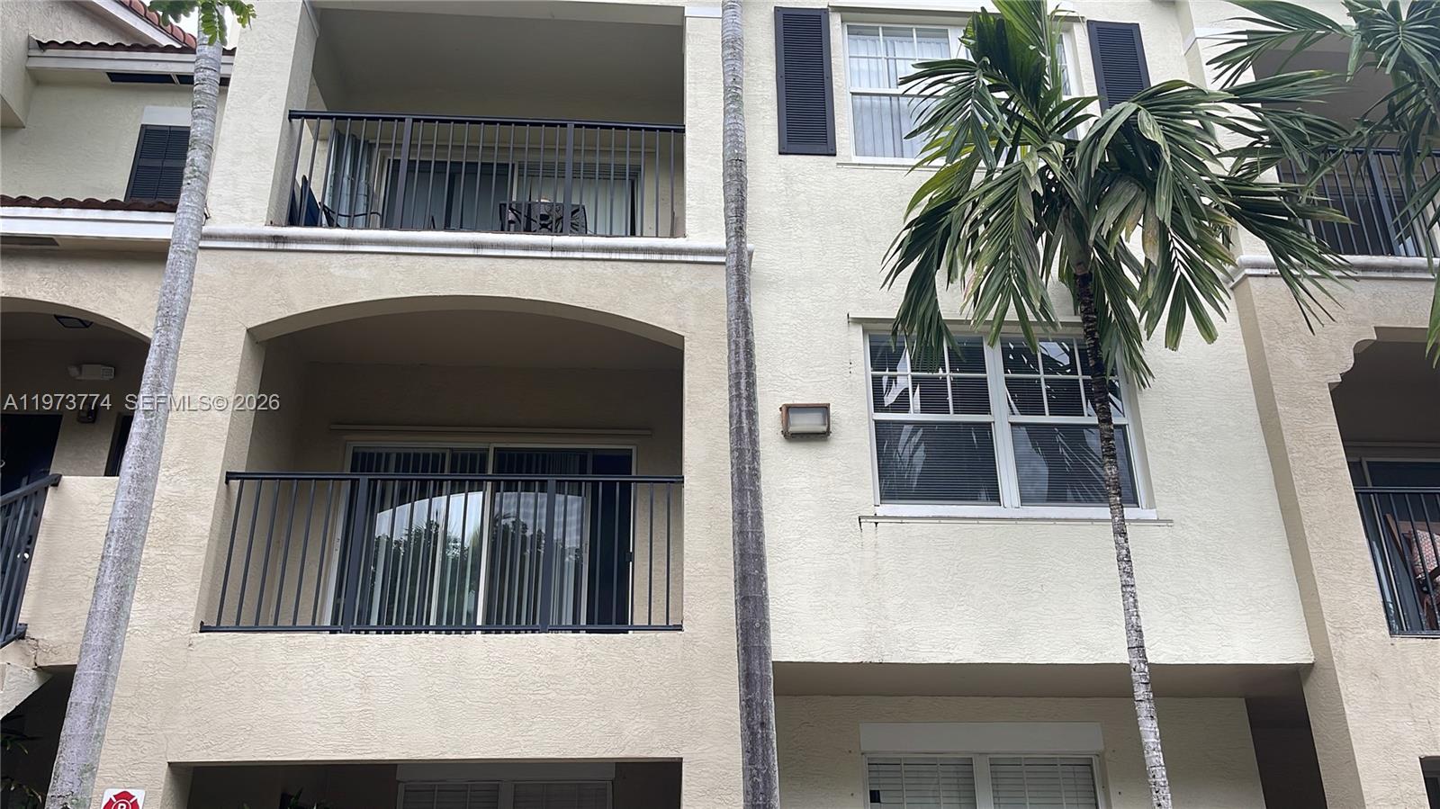 6020 West Sample Road, Unit 207 Coral Springs, FL 33067 - Photo 3 of 17 a view of front door