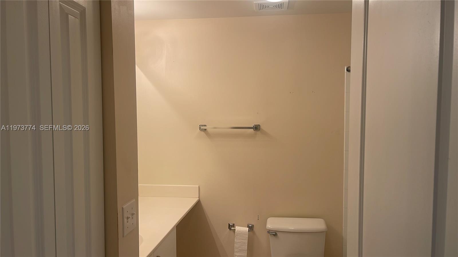 6020 West Sample Road, Unit 207 Coral Springs, FL 33067 - Photo 7 of 17 a bathroom with a toilet and a shower
