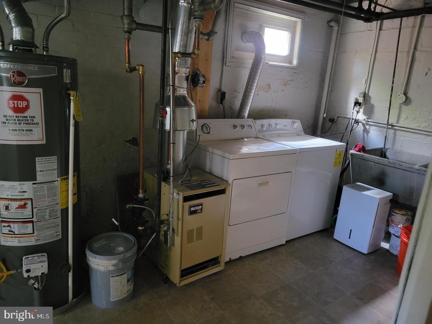 8404 Cedar Street Silver Spring, MD 20910 - Photo 12 of 18 Functional laundry and utility space.