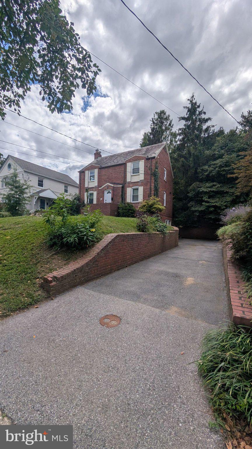 8404 Cedar Street Silver Spring, MD 20910 - Photo 16 of 18 Charming brick home with lush greenery.