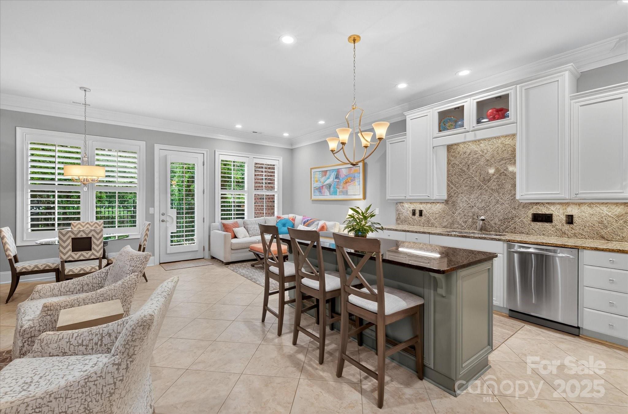 9614 Wheatfield Road Charlotte, NC 28277 - Photo 12 of 47 a large kitchen with a table and chairs