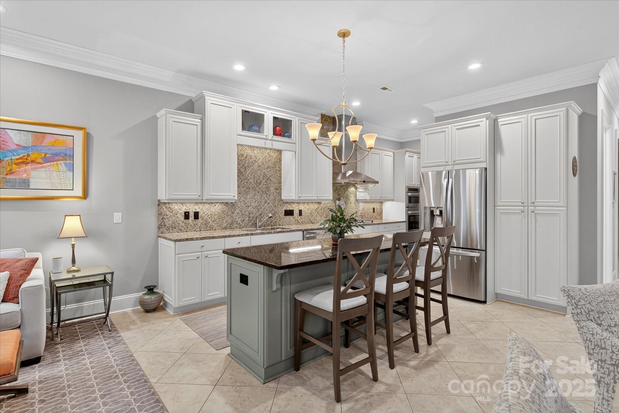 9614 Wheatfield Road Charlotte, NC 28277 - Photo 14 of 47 a large kitchen with a table and chairs