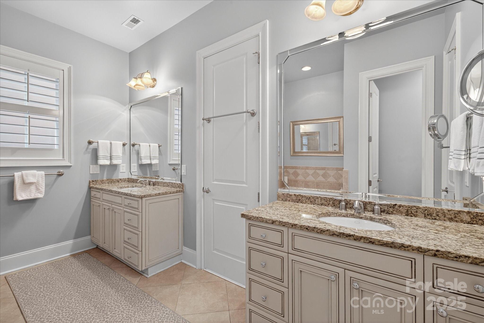 9614 Wheatfield Road Charlotte, NC 28277 - Photo 25 of 47 a bathroom with a granite countertop sink a mirror and a shower