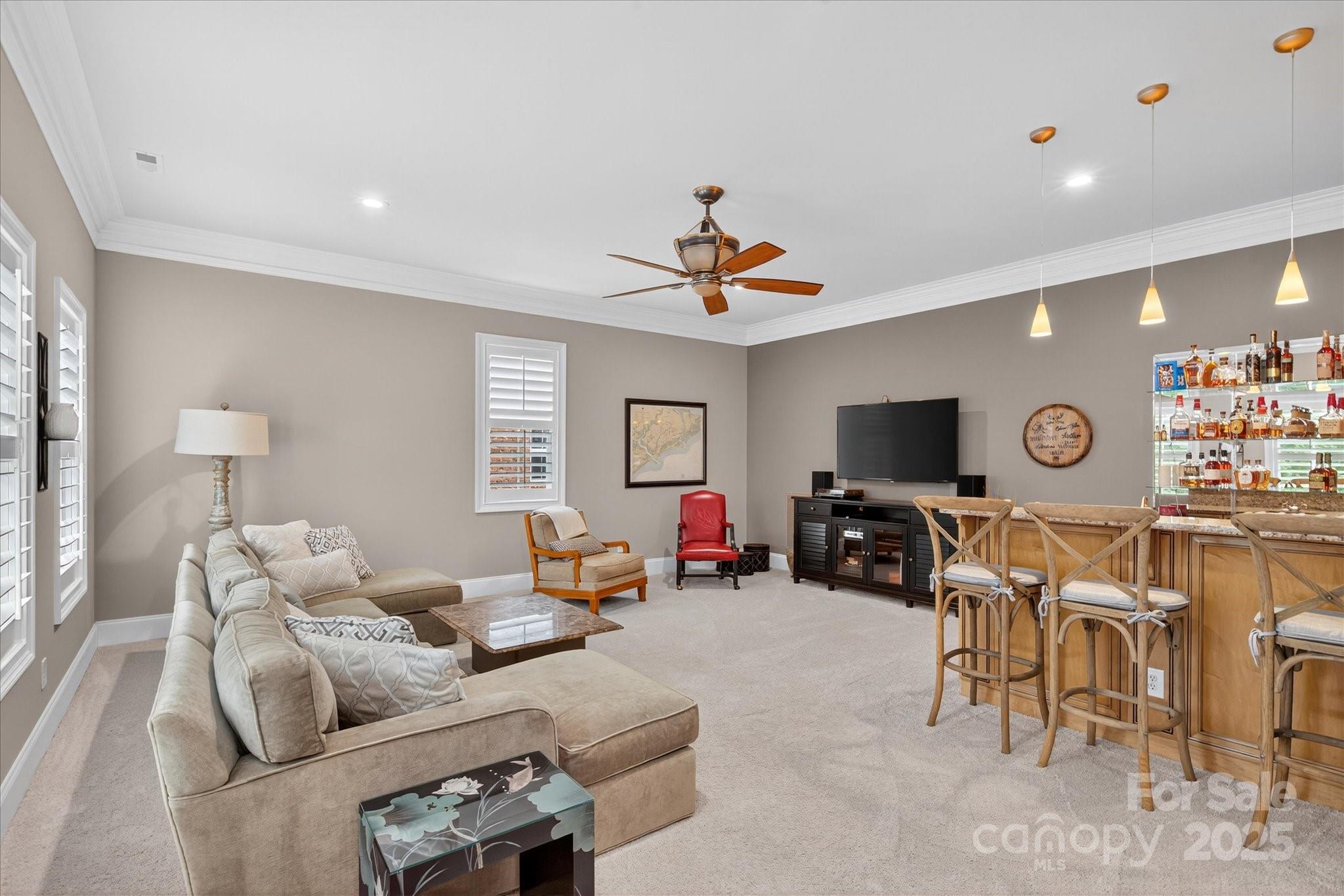 9614 Wheatfield Road Charlotte, NC 28277 - Photo 30 of 47 a living room with furniture a flat screen tv and a window