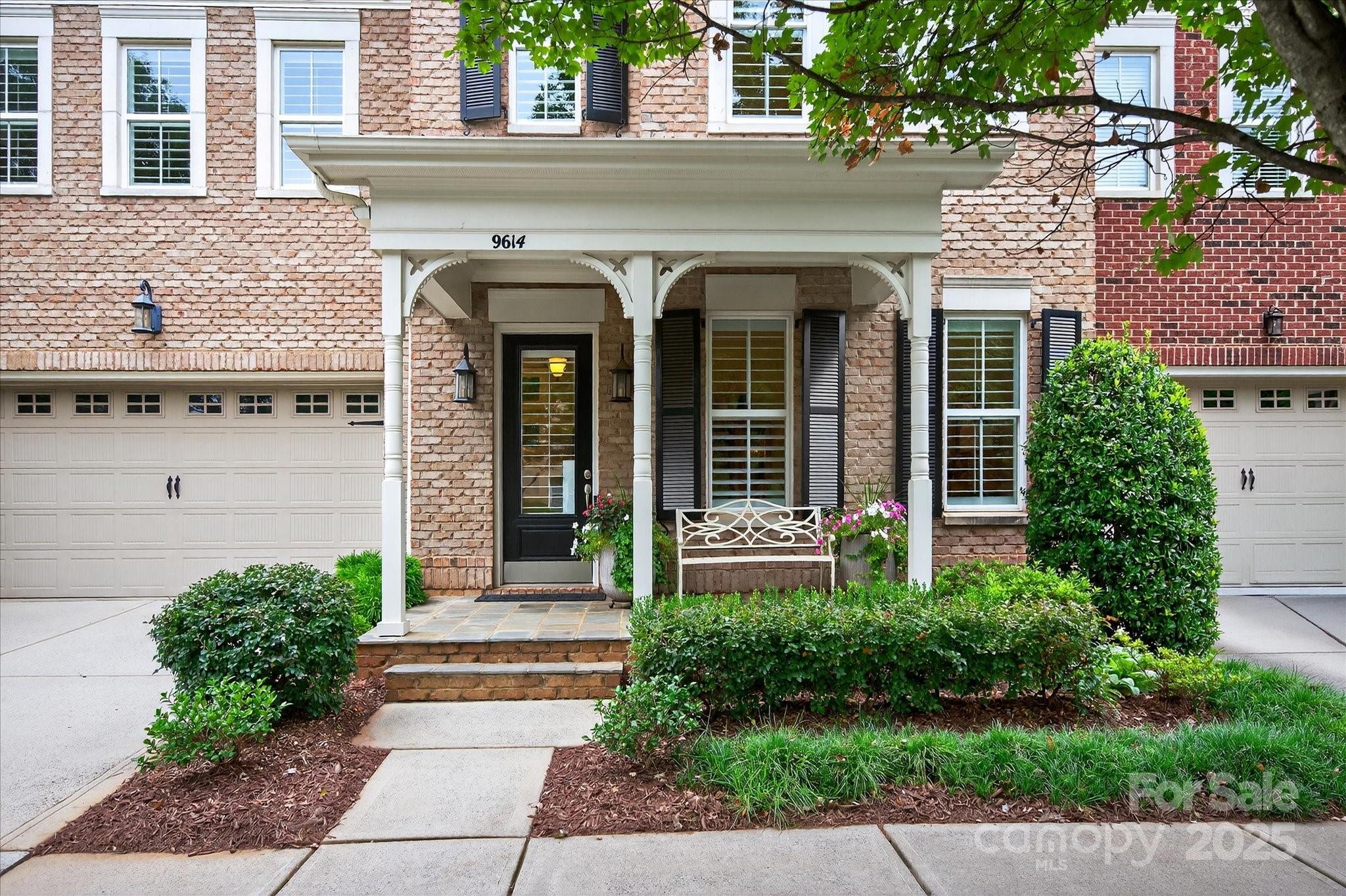 9614 Wheatfield Road Charlotte, NC 28277 - Photo 3 of 47 a front view of a house with a garden