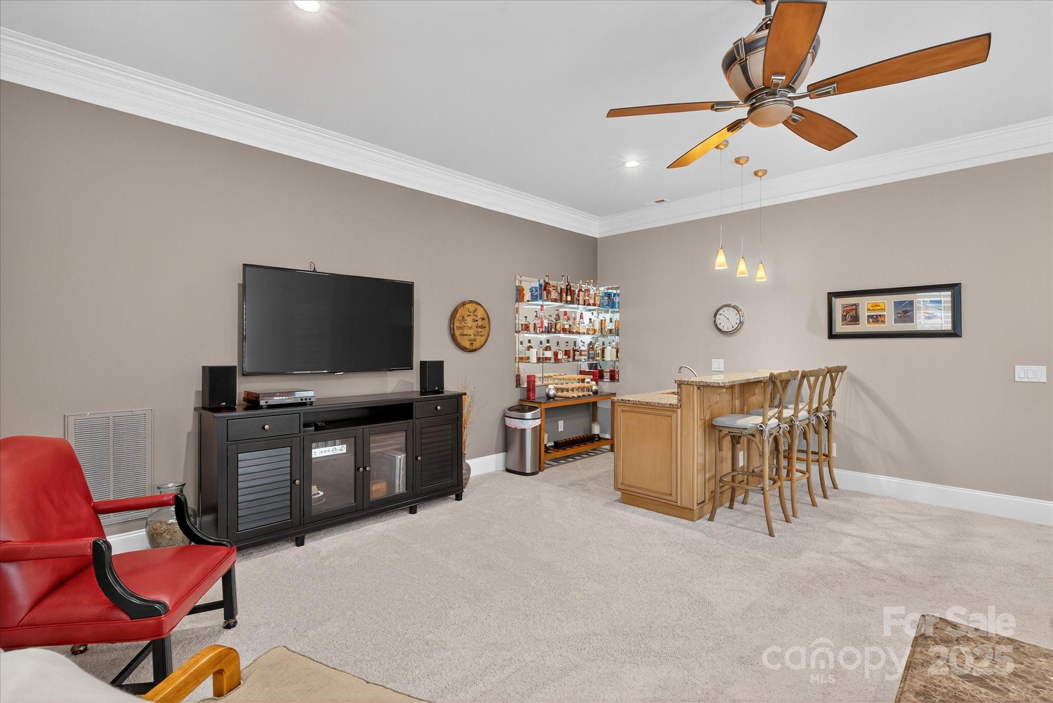 9614 Wheatfield Road Charlotte, NC 28277 - Photo 31 of 47 a view of a livingroom with furniture and a flat screen tv