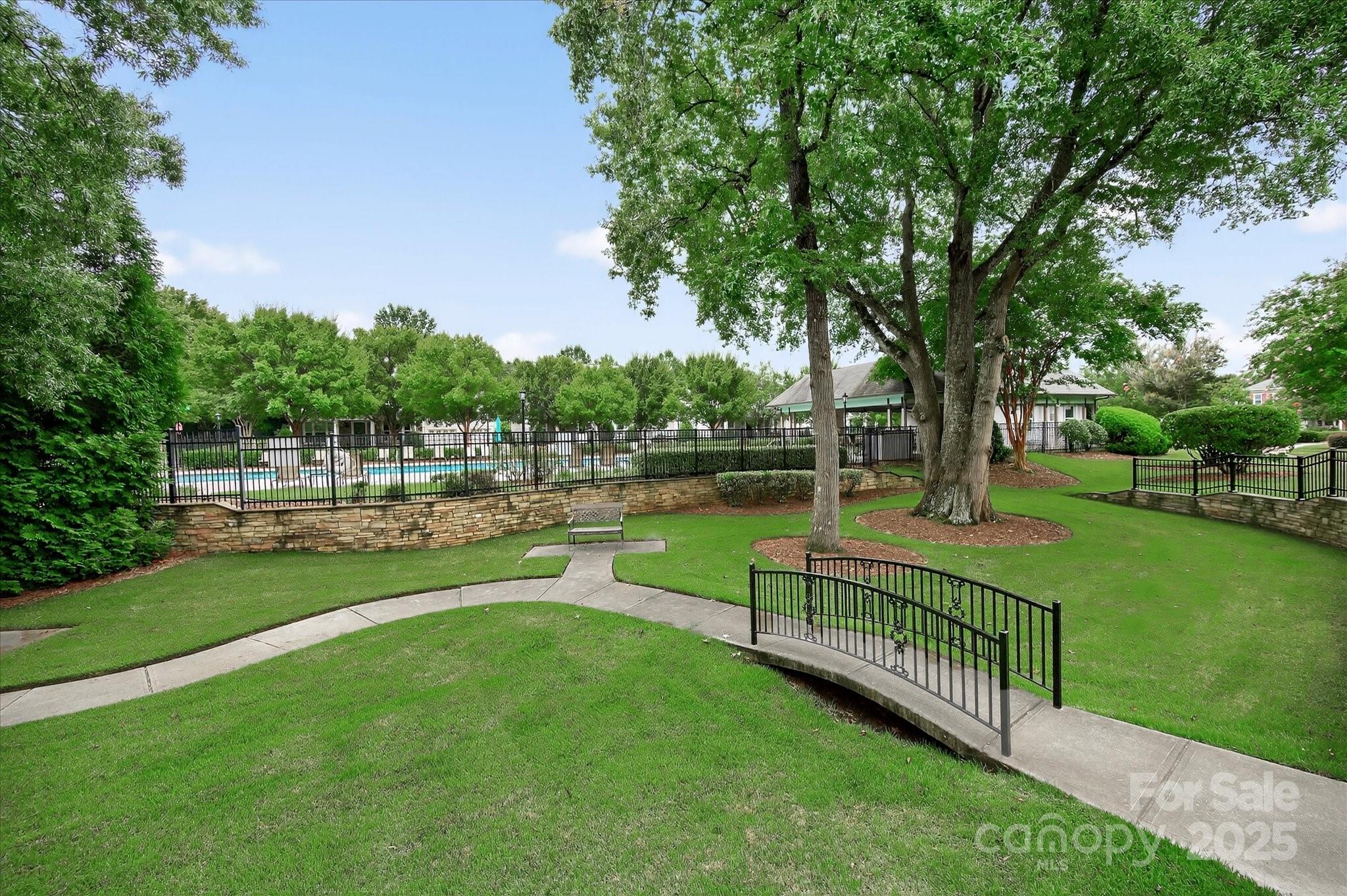 9614 Wheatfield Road Charlotte, NC 28277 - Photo 40 of 47 a view of a park with trees and wooden fence