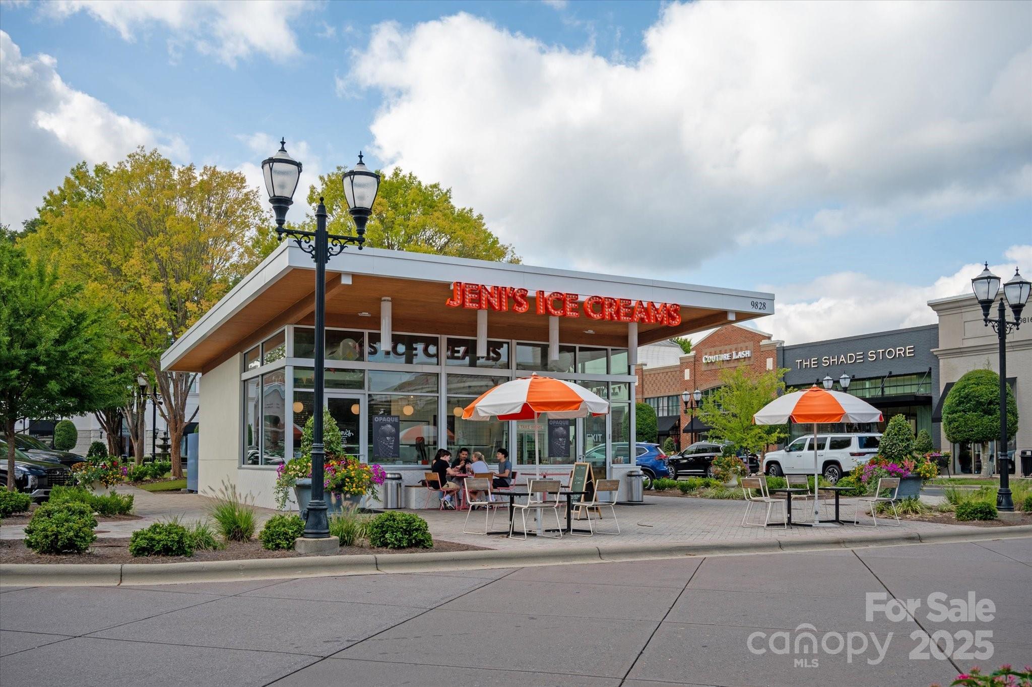 9614 Wheatfield Road Charlotte, NC 28277 - Photo 45 of 47 a group of people sitting in front of a store