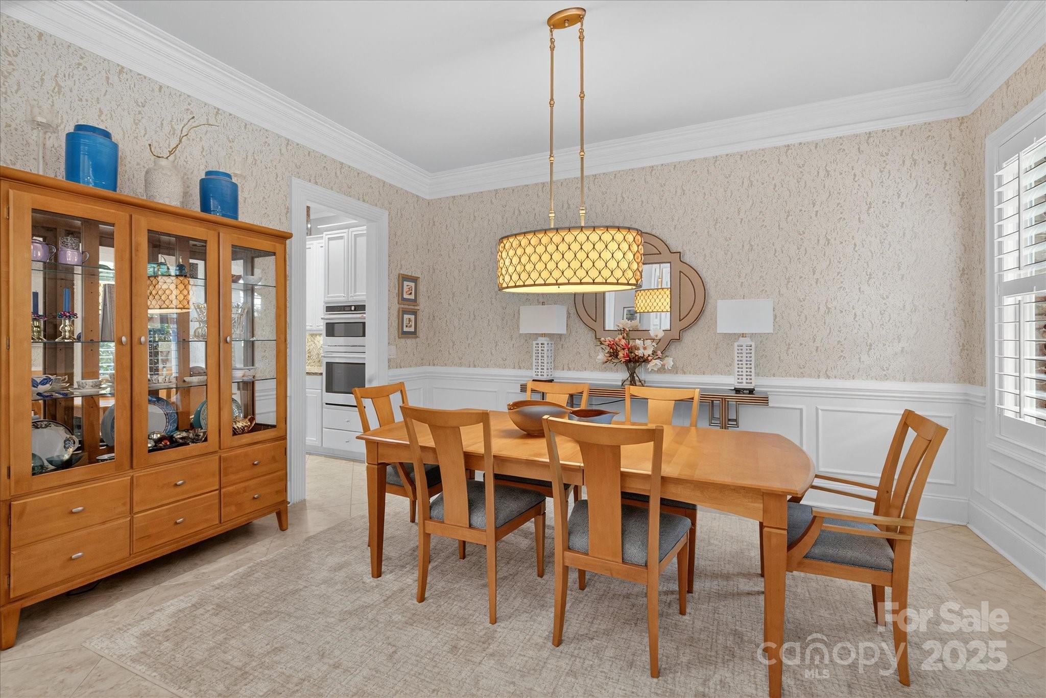 9614 Wheatfield Road Charlotte, NC 28277 - Photo 9 of 47 a view of a dining room with furniture a chandelier and a window