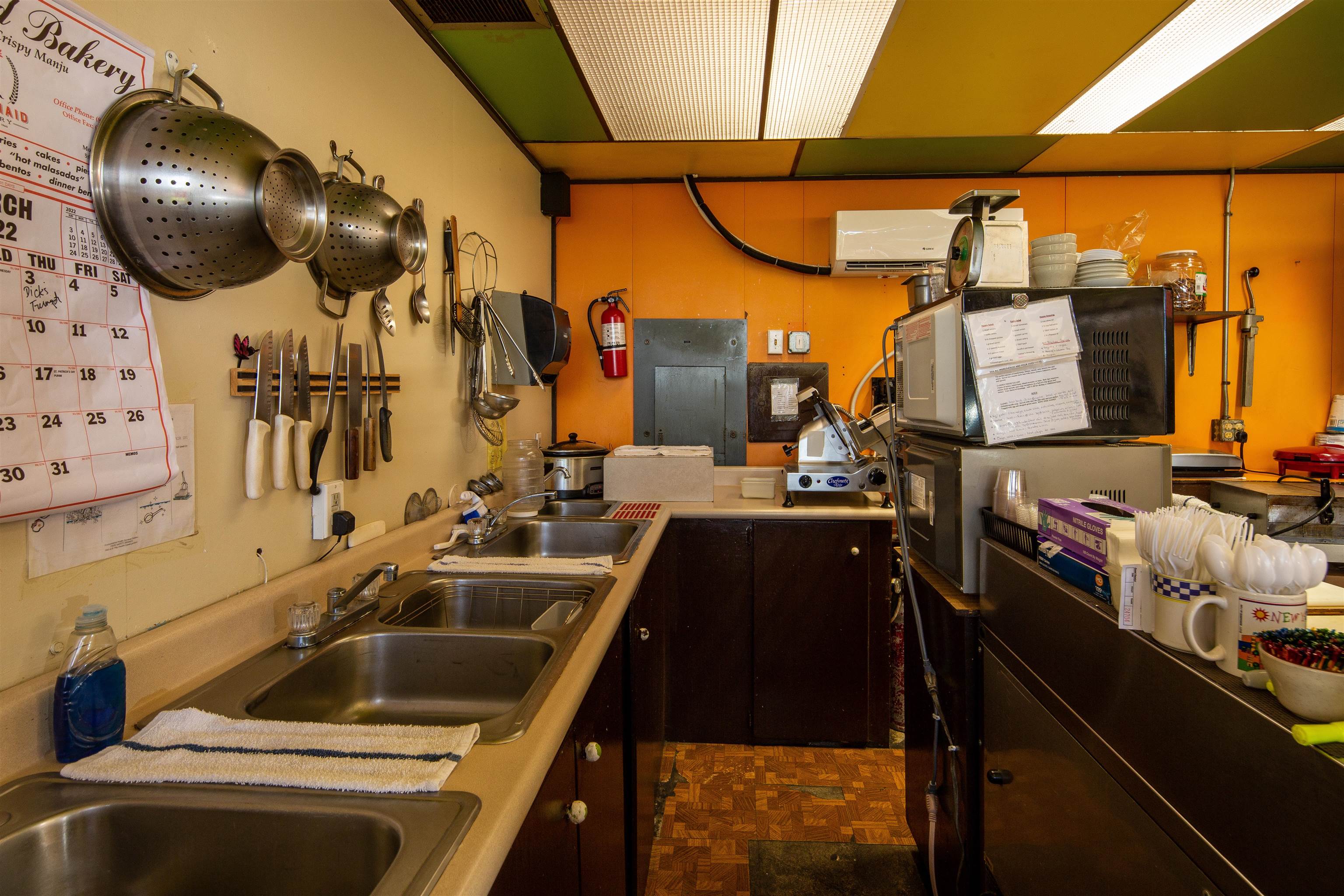 145 North Kihei Road Kihei, HI 96753 - Photo 24 of 29 a kitchen with a sink and cabinets