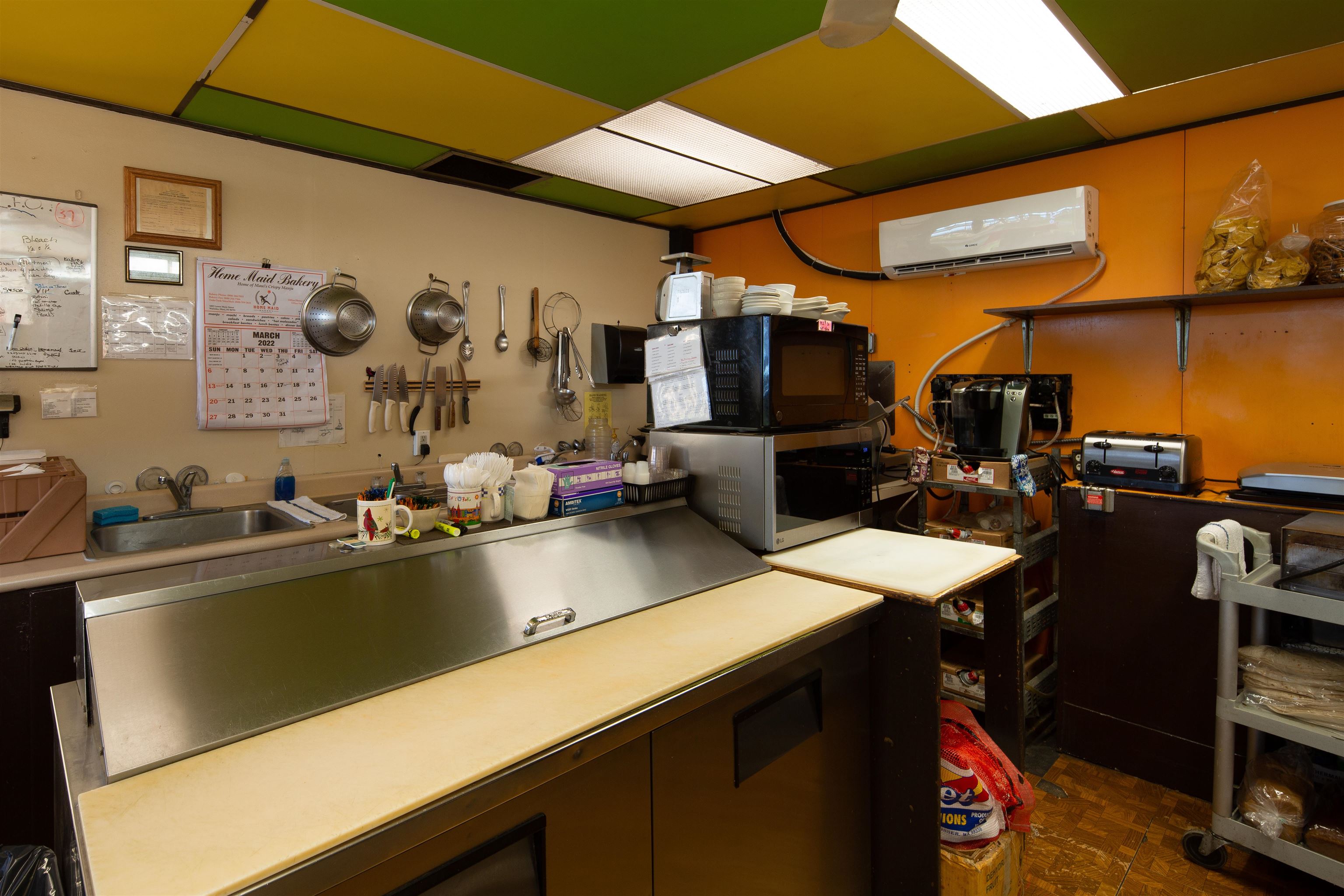 145 North Kihei Road Kihei, HI 96753 - Photo 25 of 29 a kitchen with a table and chairs in it