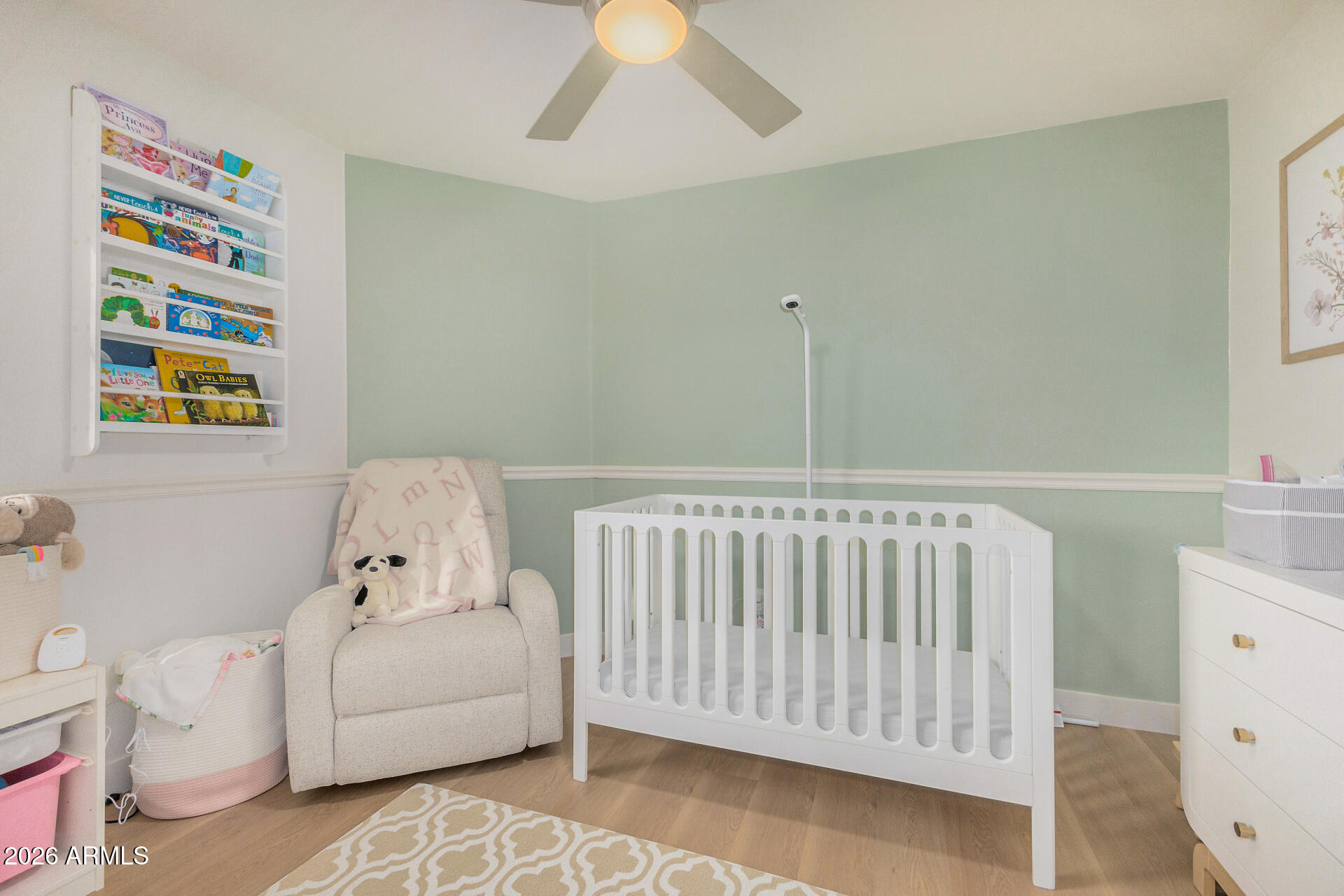 2725 East Mine Creek Road, Unit 1101 Phoenix, AZ 85024 - Photo 15 of 43 a bedroom with furniture and a baby crib