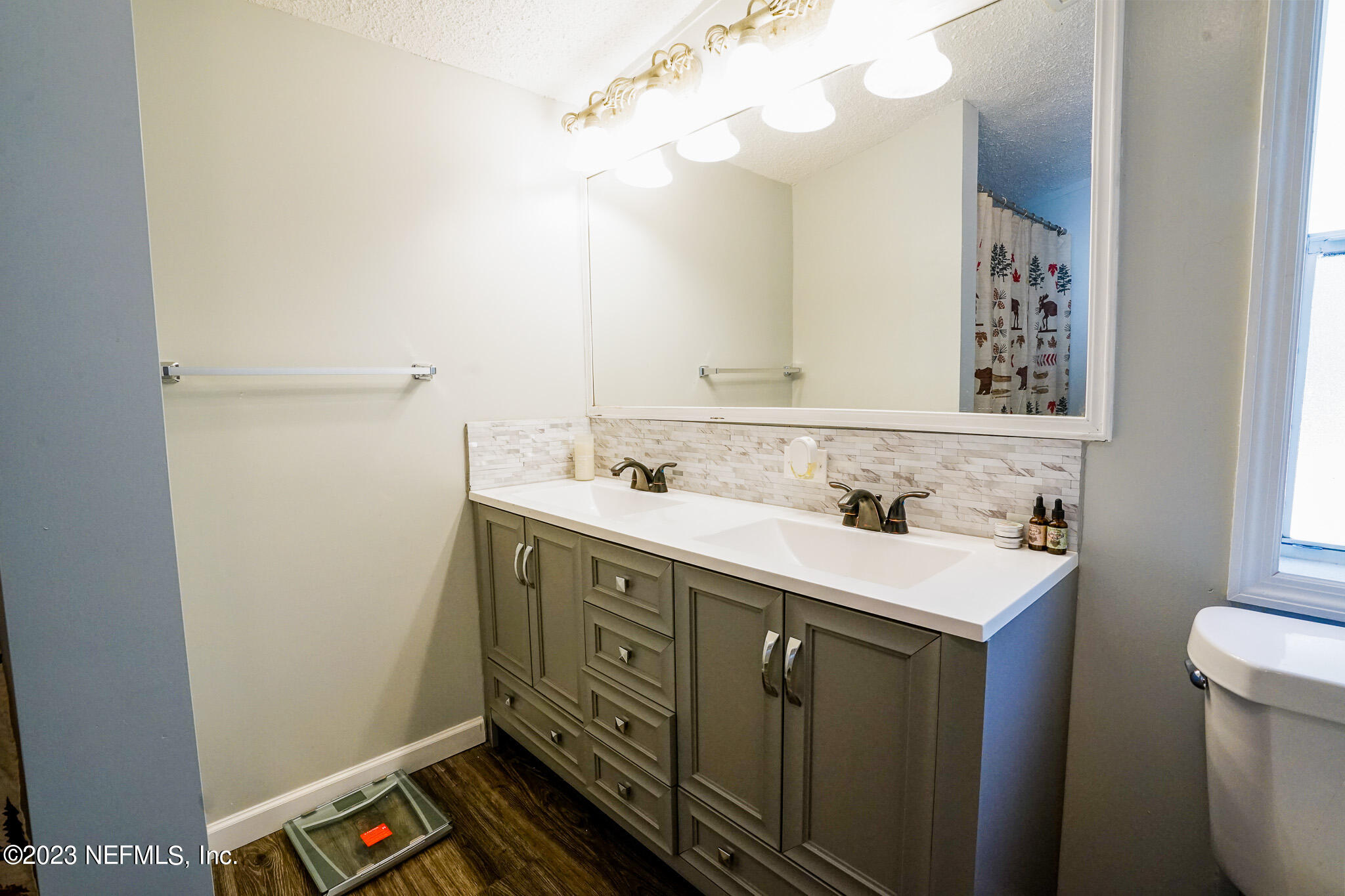 54593 Marsh Road Callahan, FL 32011 - Photo 13 of 14 a bathroom with a sink vanity and a mirror