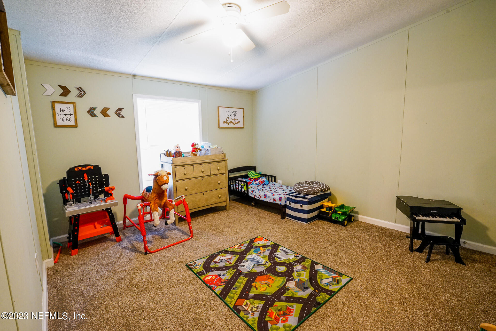 54593 Marsh Road Callahan, FL 32011 - Photo 8 of 14 a bedroom with furniture and a wooden floor