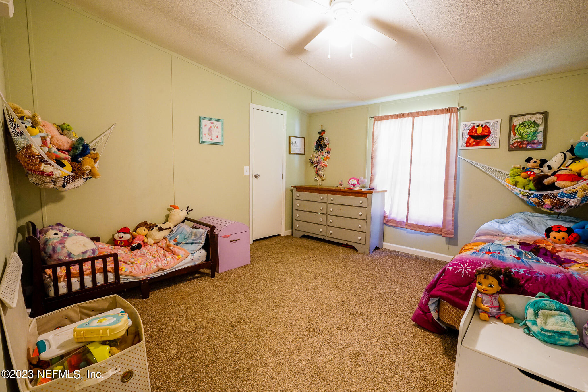 54593 Marsh Road Callahan, FL 32011 - Photo 10 of 14 a bedroom with bed and window