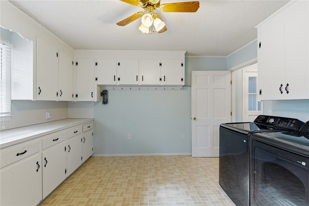 106 Cherokee Circle Anderson, SC 29621 - Photo 36 of 45 Functional utility room with ample storage cabinetry and a cheerful tile floor.