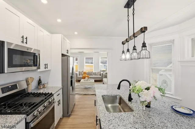 a kitchen with furniture and a stove top oven