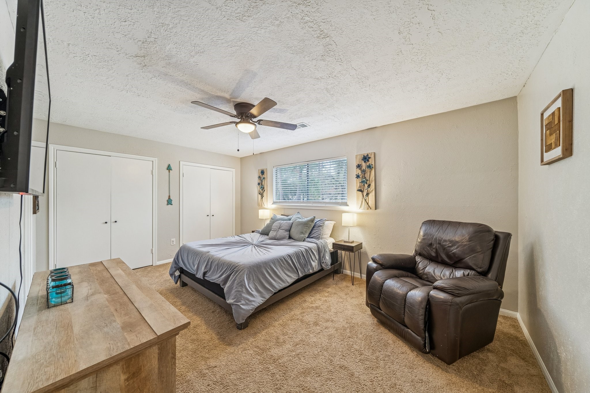 3315 Candleridge Drive Spring, TX 77388 - Photo 8 of 25 Discover the perfect retreat in this spacious secondary bedroom, featuring cozy carpeting, ample natural light, and room for relaxation.