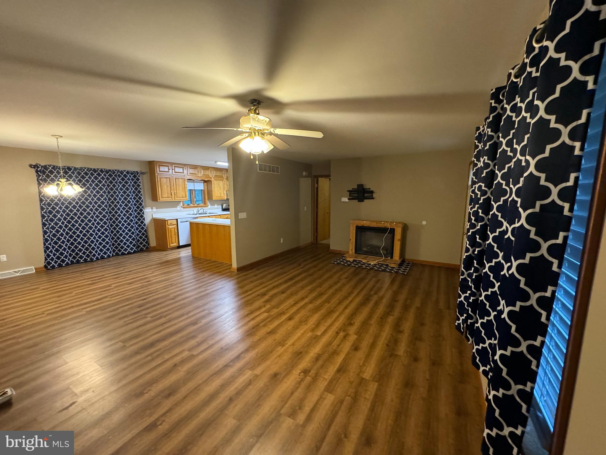 1497 Chimney Hill Road Felton, DE 19943 - Photo 3 of 8 wooden floor in an empty room with a fireplace