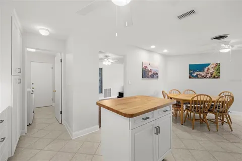 a open kitchen with a table and chairs in it