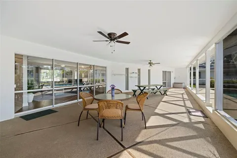 a view of a livingroom with furniture and a ceiling fan