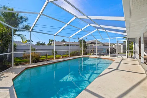a view of a backyard with sitting area