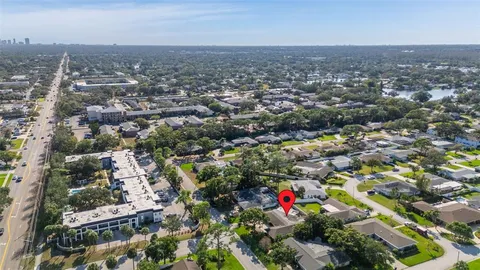 an aerial view of residential houses with outdoor space