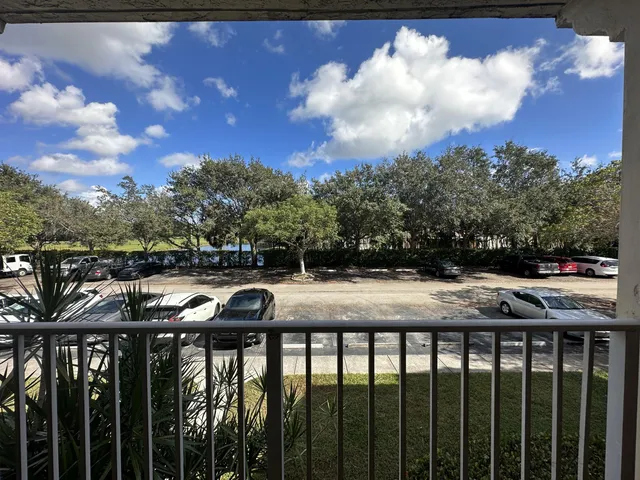 a view of a balcony with wooden fence