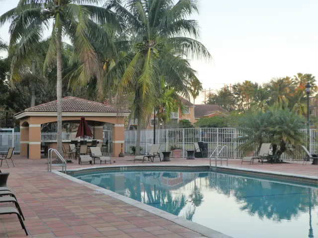 a view of a swimming pool with chairs