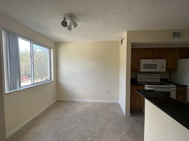 a kitchen that has a sink and a stove