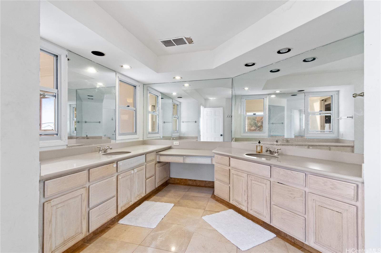 483 Maono Loop Honolulu, HI 96821 - Photo 11 of 25 a large kitchen with a lot of white cabinets