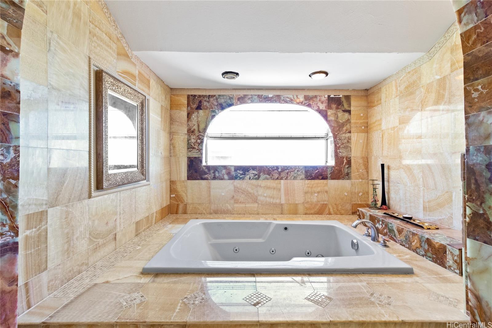 483 Maono Loop Honolulu, HI 96821 - Photo 13 of 25 a bathroom with a tub a window and a shower