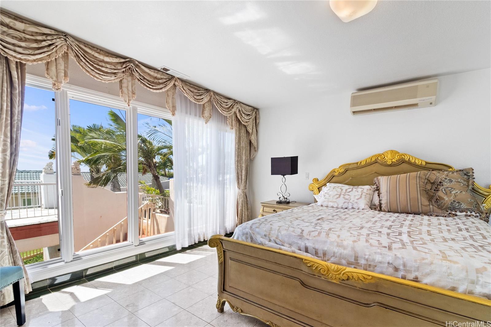 483 Maono Loop Honolulu, HI 96821 - Photo 14 of 25 a bedroom with a bed and a window