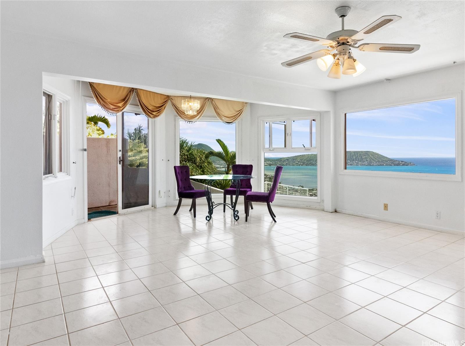 483 Maono Loop Honolulu, HI 96821 - Photo 15 of 25 a dining room with furniture and a floor to ceiling window