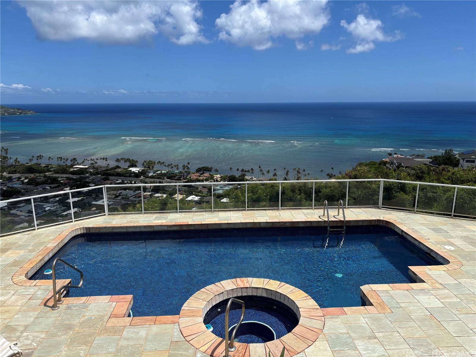 483 Maono Loop Honolulu, HI 96821 - Photo 21 of 25 a view of a swimming pool with a lounge chair