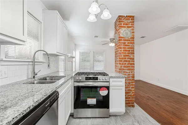 a kitchen with a stove and a sink