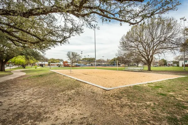 a view of a park and fence