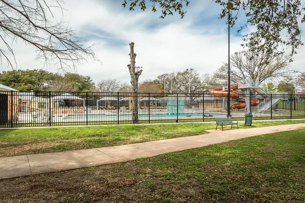 a view of a park with swings and slides