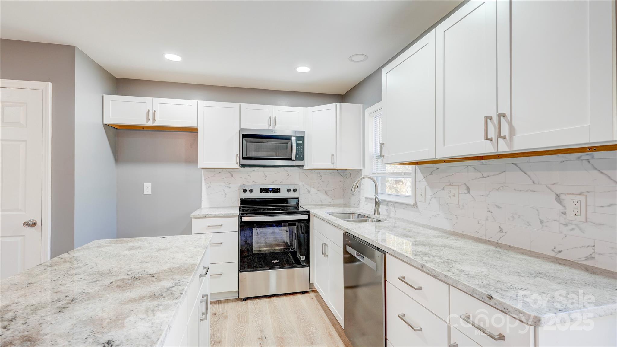 460 Chalk Maple Road China Grove, NC 28023 - Photo 12 of 33 a kitchen with granite countertop a sink and steel appliances