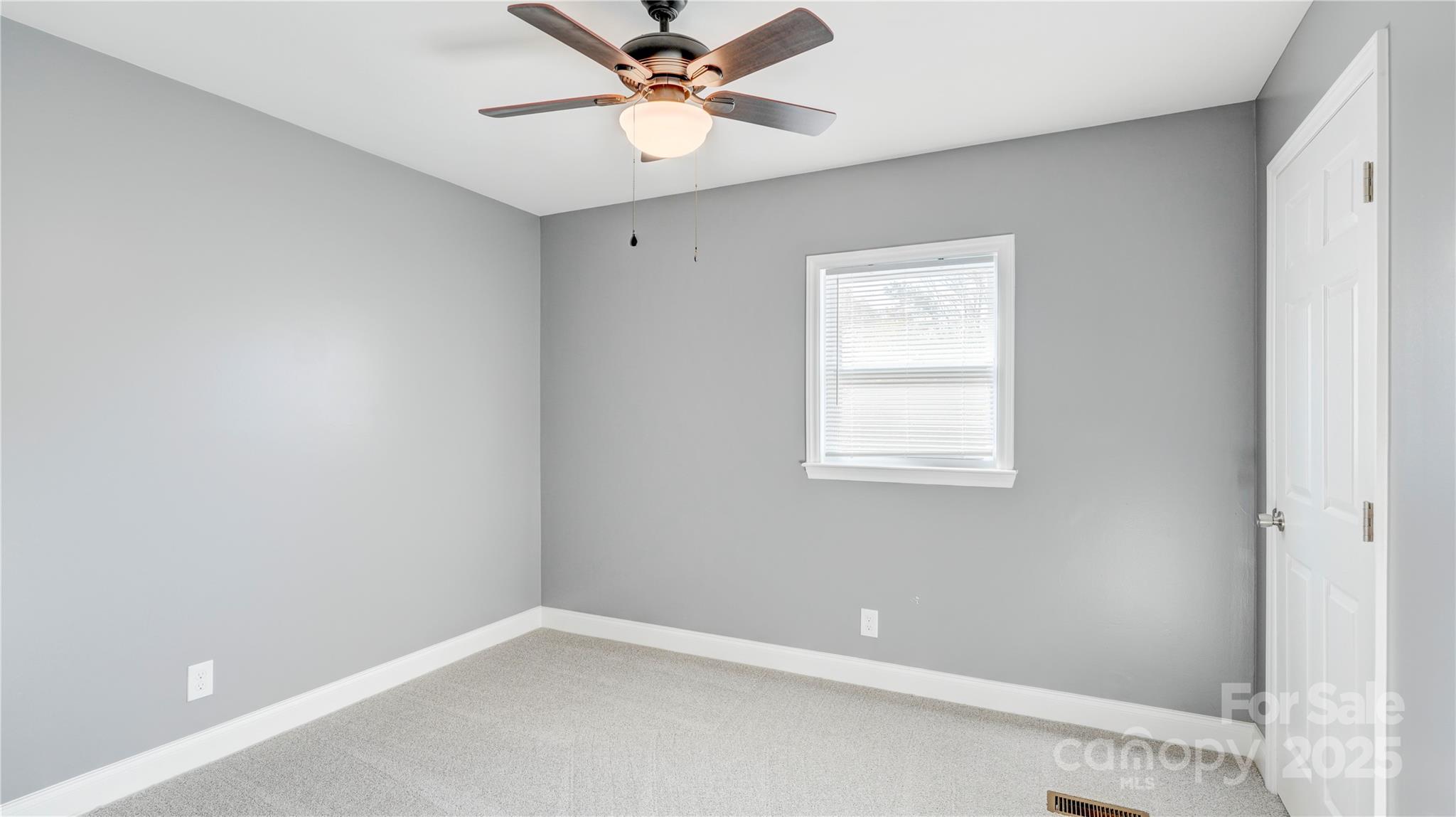 460 Chalk Maple Road China Grove, NC 28023 - Photo 17 of 33 an empty room with a window and a fan