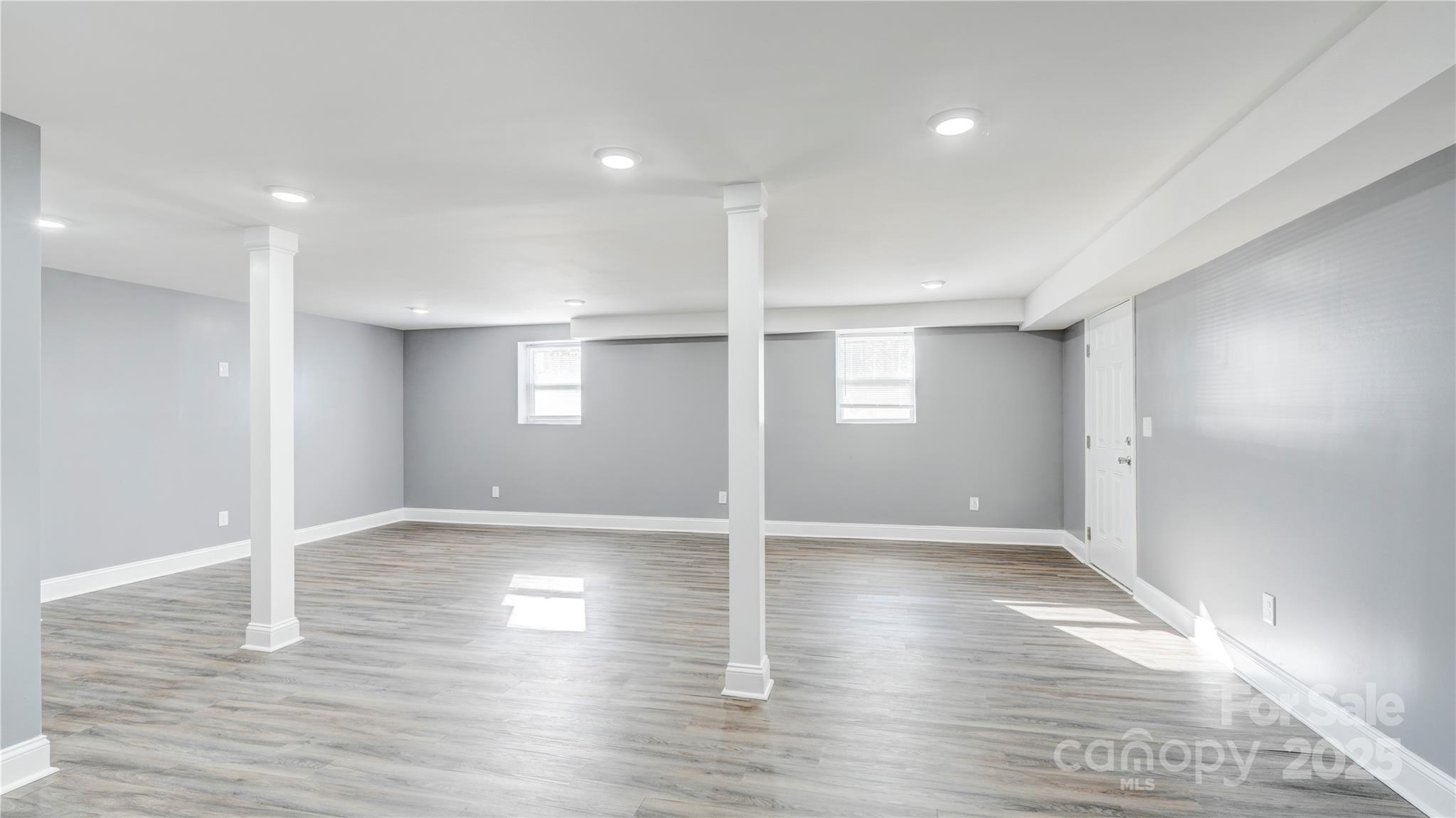 460 Chalk Maple Road China Grove, NC 28023 - Photo 24 of 33 an empty room with wooden floor and windows