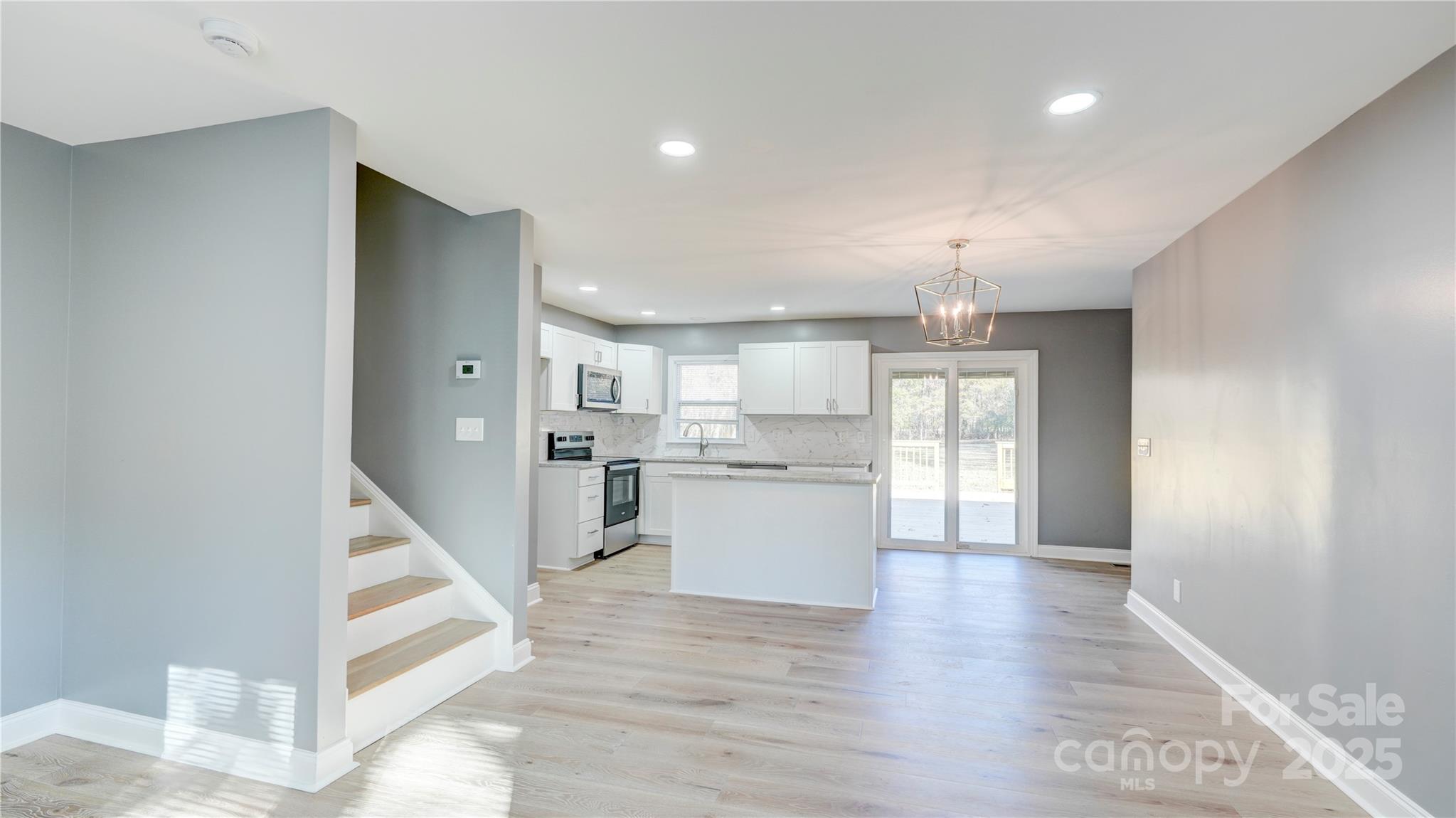 460 Chalk Maple Road China Grove, NC 28023 - Photo 10 of 33 a view of a kitchen with wooden floor and a kitchen
