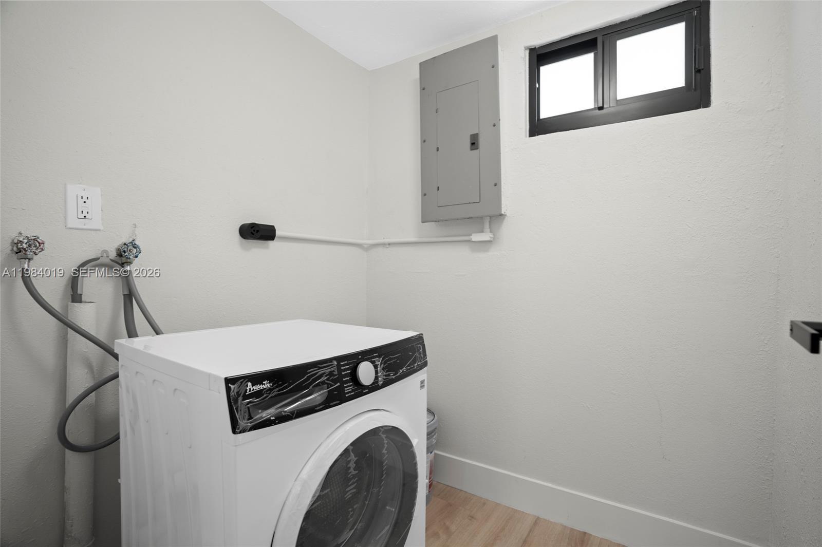 28015 Southwest 143rd Court Homestead, FL 33033 - Photo 11 of 29 a utility room with dryer and washer