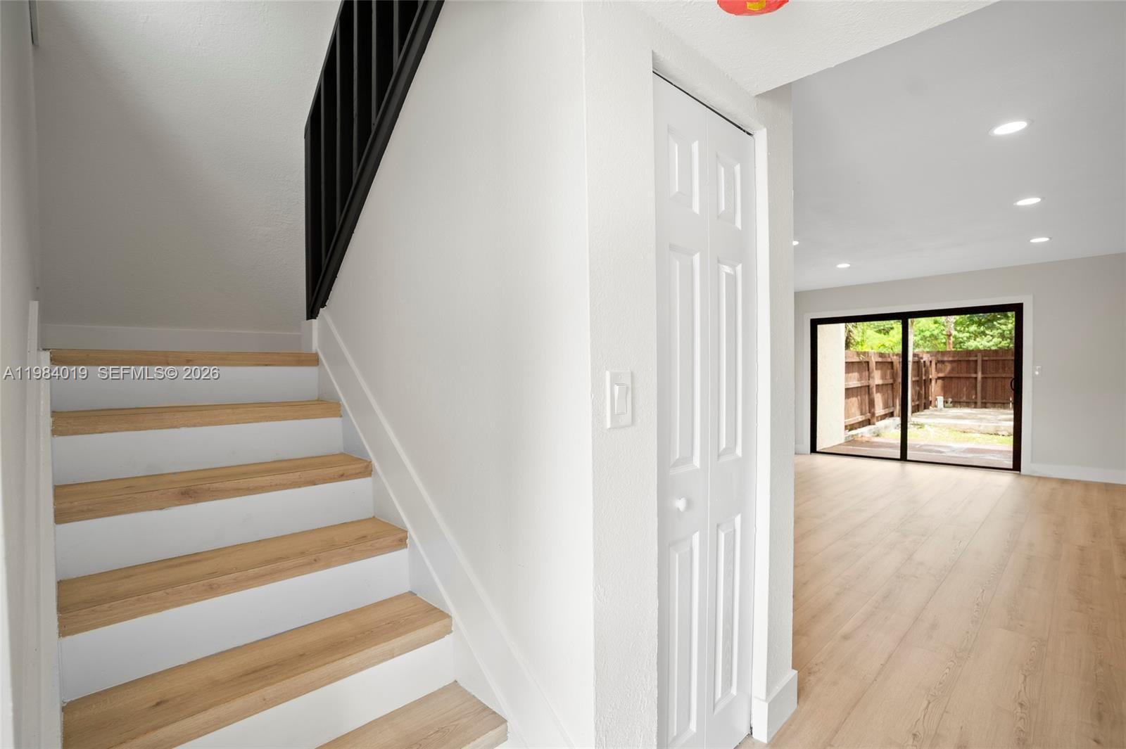 28015 Southwest 143rd Court Homestead, FL 33033 - Photo 13 of 29 a view of an entryway with wooden floor and windows