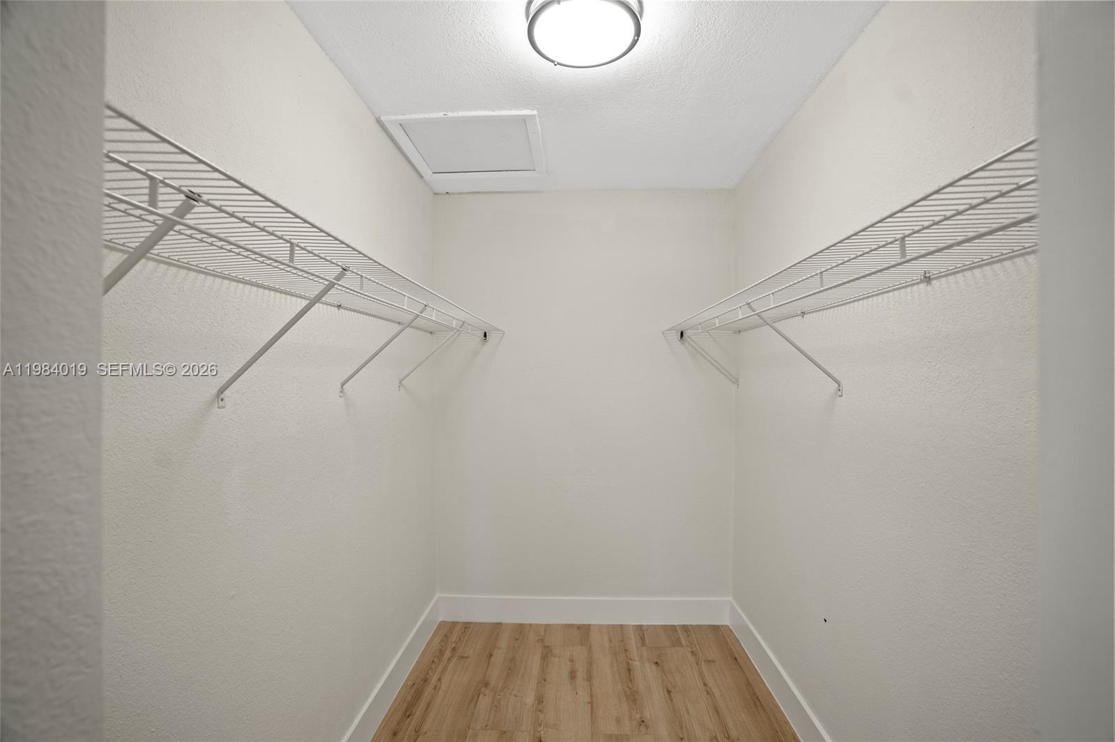 28015 Southwest 143rd Court Homestead, FL 33033 - Photo 17 of 29 a view of a room with racks on the wall