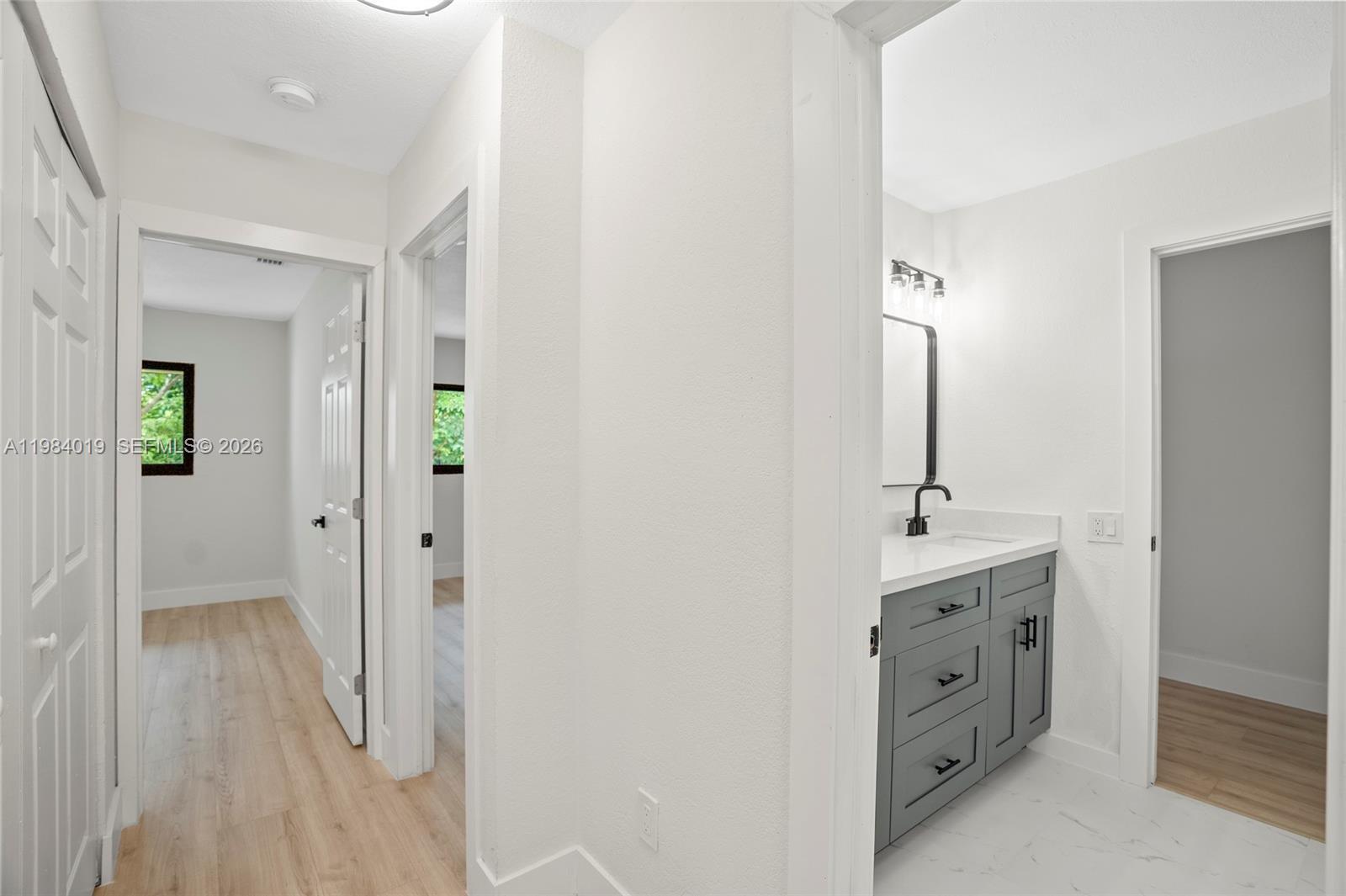 28015 Southwest 143rd Court Homestead, FL 33033 - Photo 18 of 29 a spacious bathroom with a double vanity sink and a mirror
